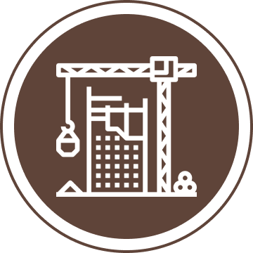 Icon of a construction crane next to a building under construction, on a brown circular background.